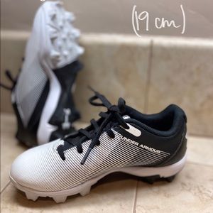 Under Armour kids cleats.